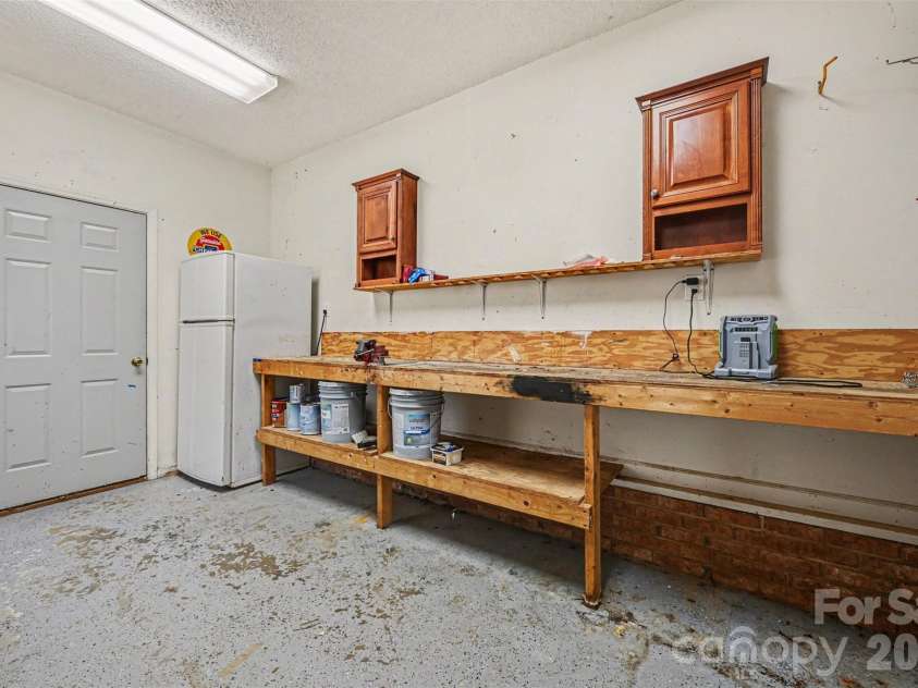 7329 Bailywick Drive, Waxhaw, NC 28173.  MLS# CAR4334755, YatesRealty ID 15632. Workroom off Garage