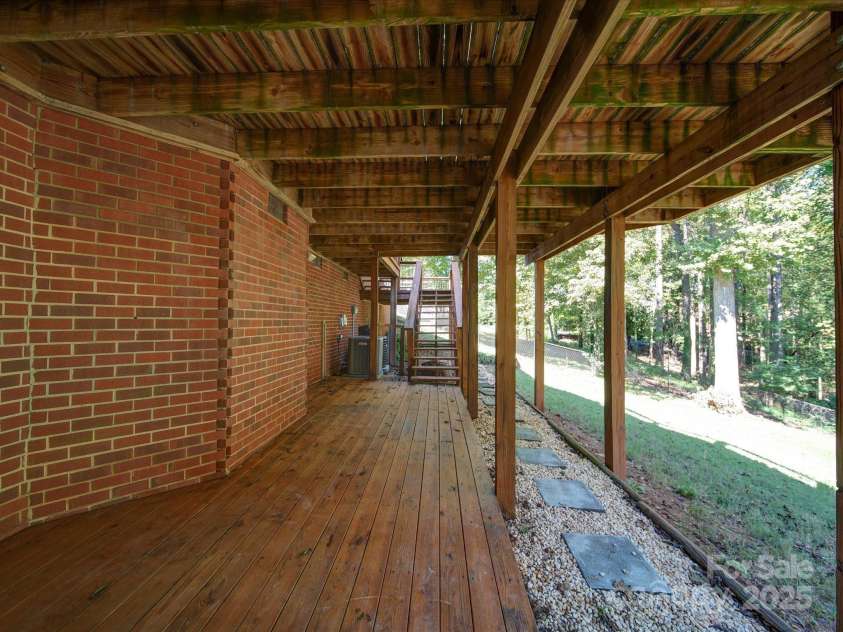 907 Weymouth Drive, Gastonia, NC 28056.  MLS# CAR4187404, YatesRealty ID 15632. Patio area on Basement level
