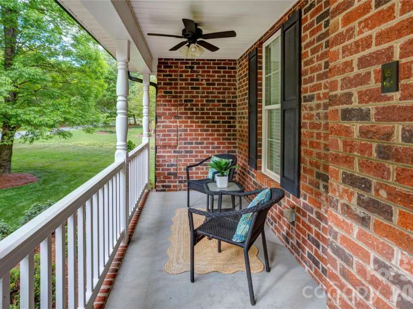 1390 Bennington Drive, Concord, NC 28027.  MLS# CAR4371953, YatesRealty ID 15633. Front porch sitting