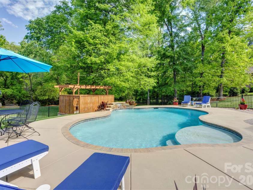 1390 Bennington Drive, Concord, NC 28027.  MLS# CAR4371953, YatesRealty ID 15633. Large pool deck area