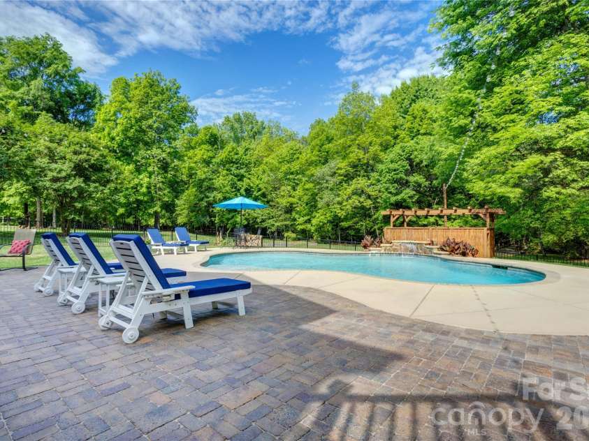 1390 Bennington Drive, Concord, NC 28027.  MLS# CAR4371953, YatesRealty ID 15633. Shade, serenity and space