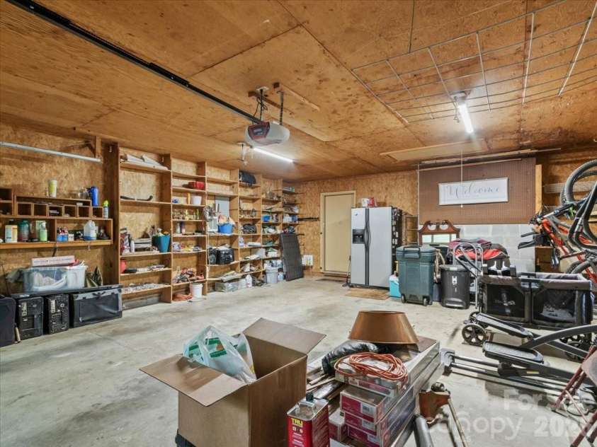 190 Executive Estates Drive, Old Fort, NC 28762.  MLS# CAR4349783, YatesRealty ID 15634. Garage with shelving