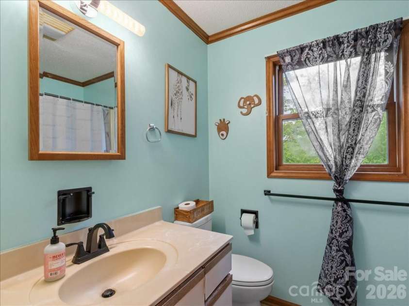 190 Executive Estates Drive, Old Fort, NC 28762.  MLS# CAR4349783, YatesRealty ID 15634. Guest bathroom