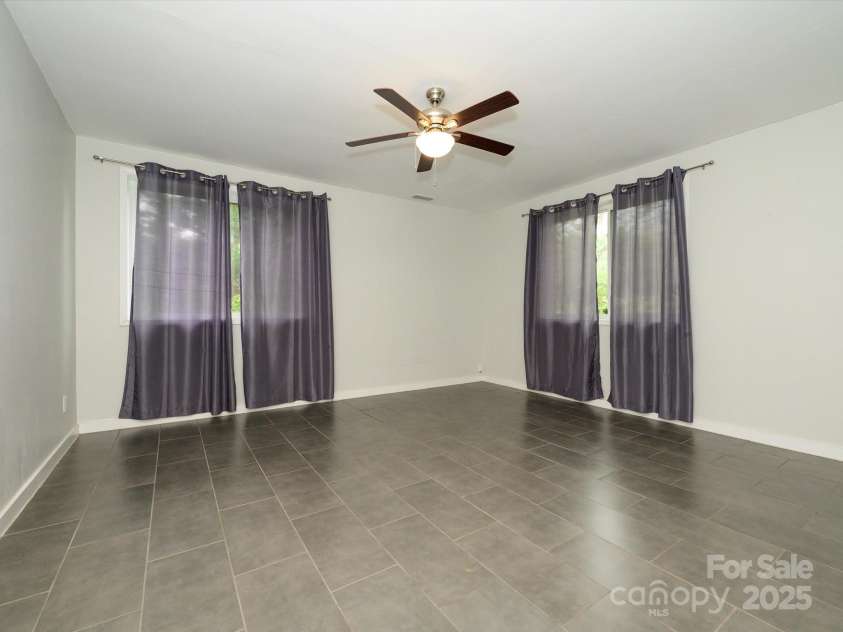 5601 Indian Brook Drive, Matthews, NC 28104.  MLS# CAR4241284, YatesRealty ID 15637. Lower level flex space - Bonus or Office