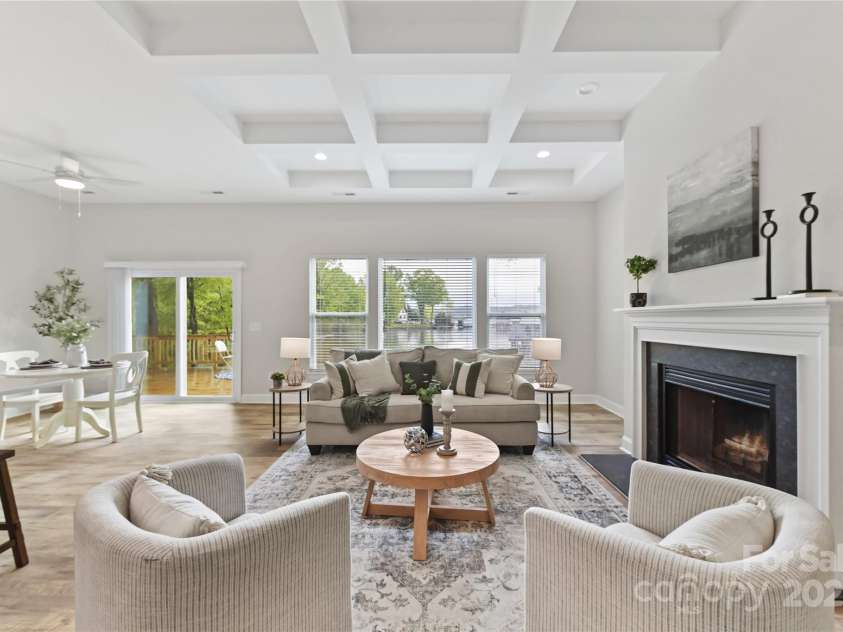 4980 Kiser Island Road, Terrell, NC 28682.  MLS# CAR4241142, YatesRealty ID 1564. Great Room features wood burning fireplace, coffered ceiling, LVP floors & gorgeous lake views!