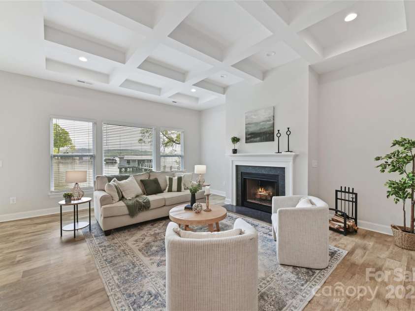 4980 Kiser Island Road, Terrell, NC 28682.  MLS# CAR4241142, YatesRealty ID 1564. Great Room features wood burning fireplace, coffered ceiling, LVP floors & gorgeous lake views!