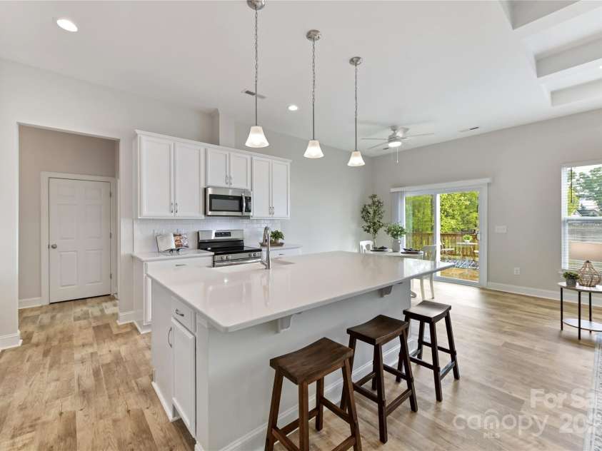 4980 Kiser Island Road, Terrell, NC 28682.  MLS# CAR4241142, YatesRealty ID 1564. Kitchen features quartz counters, island with seating/storage, stainless steel appliances, tile back splash, upgraded lighting & breakfast area!