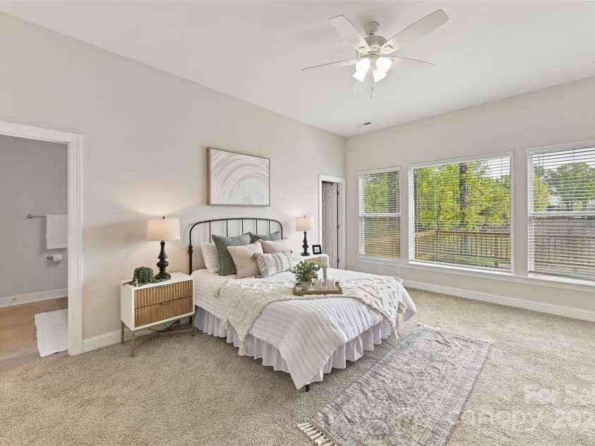 4980 Kiser Island Road, Terrell, NC 28682.  MLS# CAR4241142, YatesRealty ID 1564. Primary Suite with ceiling fan/light, private bath, walk in closet & large windows for prefect lake views!