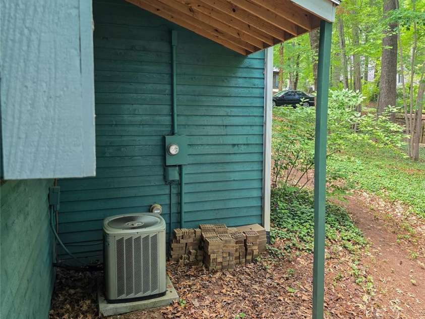 26 Autumn Ridge Lane, Asheville, NC 28803.  MLS# CAR4368314, YatesRealty ID 15650. Overhang protection for AC unit.