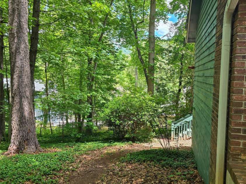 26 Autumn Ridge Lane, Asheville, NC 28803.  MLS# CAR4368314, YatesRealty ID 15650. Side trail around home.