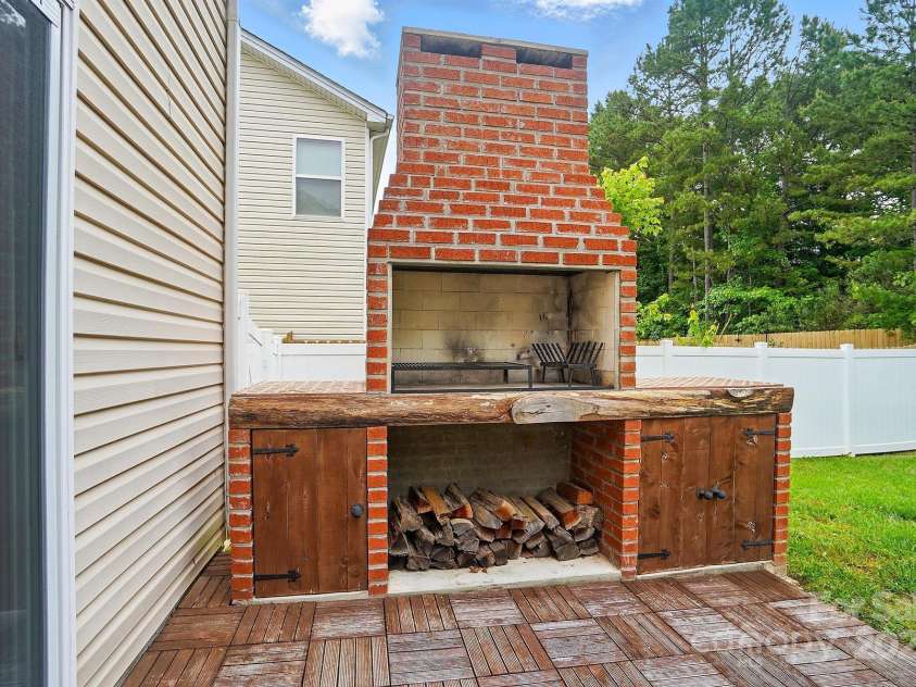 512 Nanny Point Drive, Monroe, NC 28110.  MLS# CAR4260981, YatesRealty ID 15657. Backyard/Argetinian style parrillero