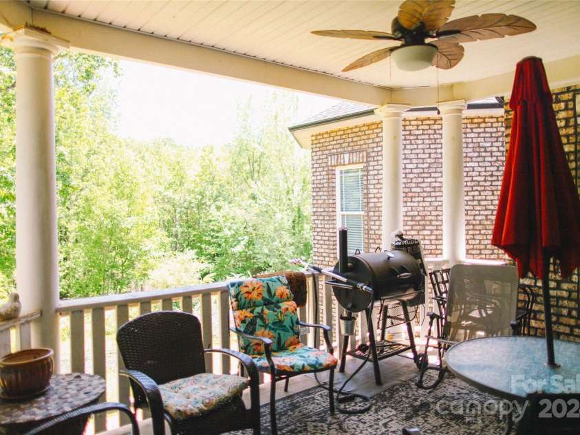 4642 King Crowder Drive, Gastonia, NC 28052.  MLS# CAR4147869, YatesRealty ID 1566. Large back balcony porch with beautiful private views and overhead fan