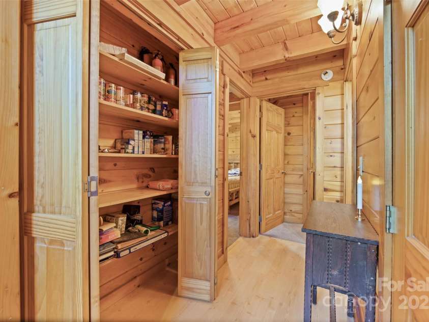 171 Irene Lane, Maggie Valley, NC 28751.  MLS# CAR4193190, YatesRealty ID 15661. From great room see left pantry storage, right coak closet, guest full bath