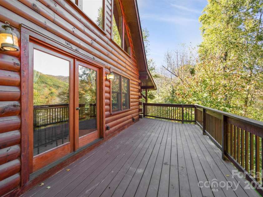 171 Irene Lane, Maggie Valley, NC 28751.  MLS# CAR4193190, YatesRealty ID 15661. Front uncovered deck open to year round view, perfect quiet spot for bird, elk, or turkey watching