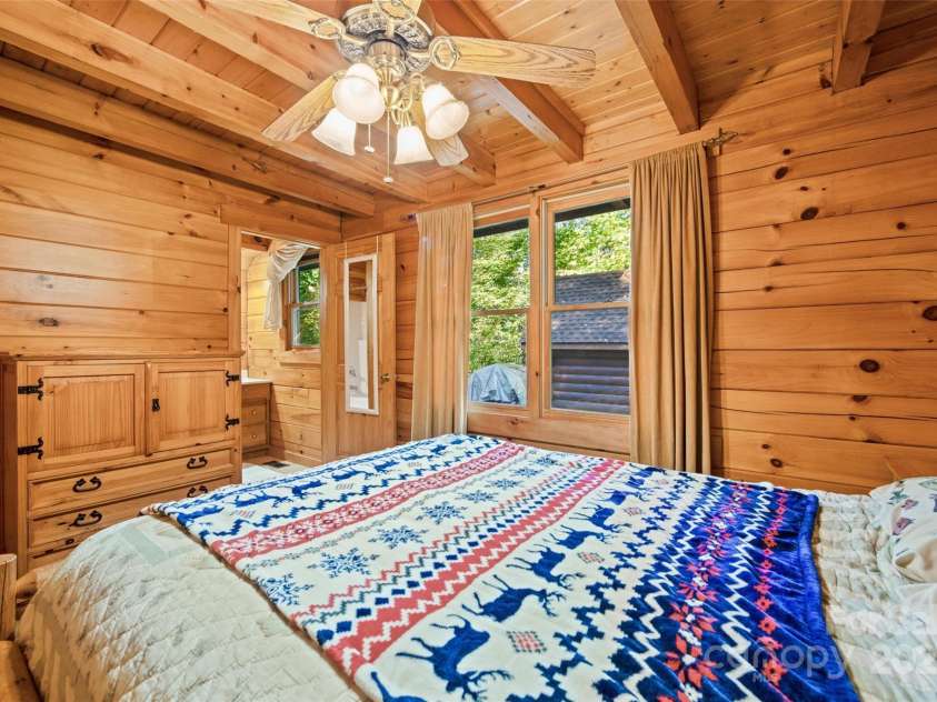 171 Irene Lane, Maggie Valley, NC 28751.  MLS# CAR4193190, YatesRealty ID 15661. View 2 primary bedroom door to bath