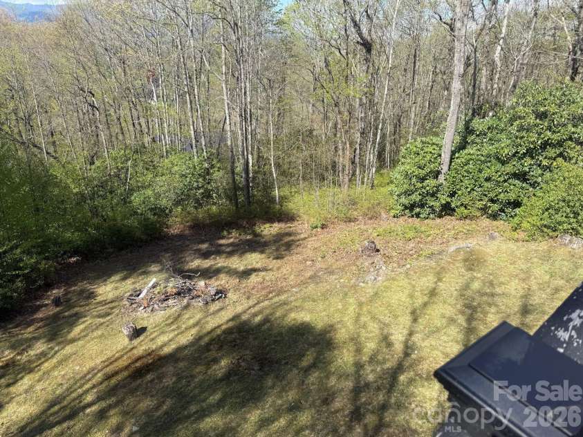78 Highland Drive, Lake Toxaway, NC 28747.  MLS# CAR4370339, YatesRealty ID 15661. Backyard