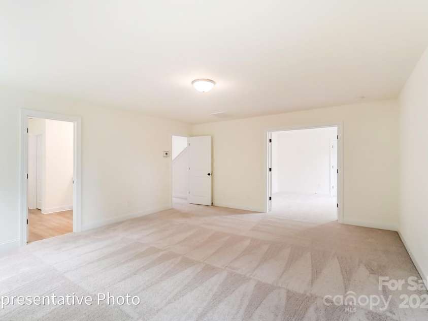 8619 Frank Grier Road, Charlotte, NC 28215.  MLS# CAR4256993, YatesRealty ID 15665. Primary room has a sitting room with glass french doors