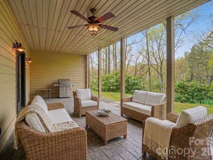 2320 Evans Road, Hendersonville, NC 28739.  MLS# CAR4366664, YatesRealty ID 15670. Basement covered patio - Virtually staged