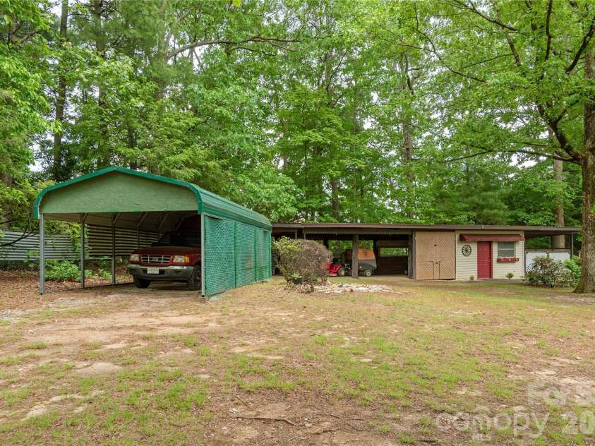 204 Reed Drive, Flat Rock, NC 28731.  MLS# CAR4355260, YatesRealty ID 15674. Extra carport.