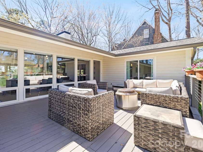 6 Pine Knoll Drive, Lake Wylie, SC 29710.  MLS# CAR4360481, YatesRealty ID 15676. Front deck space flows straight into open living space