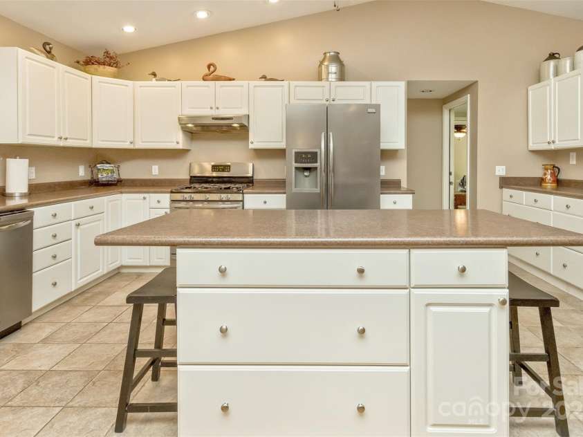 15 Beaverdam Knoll Road, Asheville, NC 28804.  MLS# CAR4283730, YatesRealty ID 1568. An oversized kitchen island is perfect for meal preparation as well as casual dining.