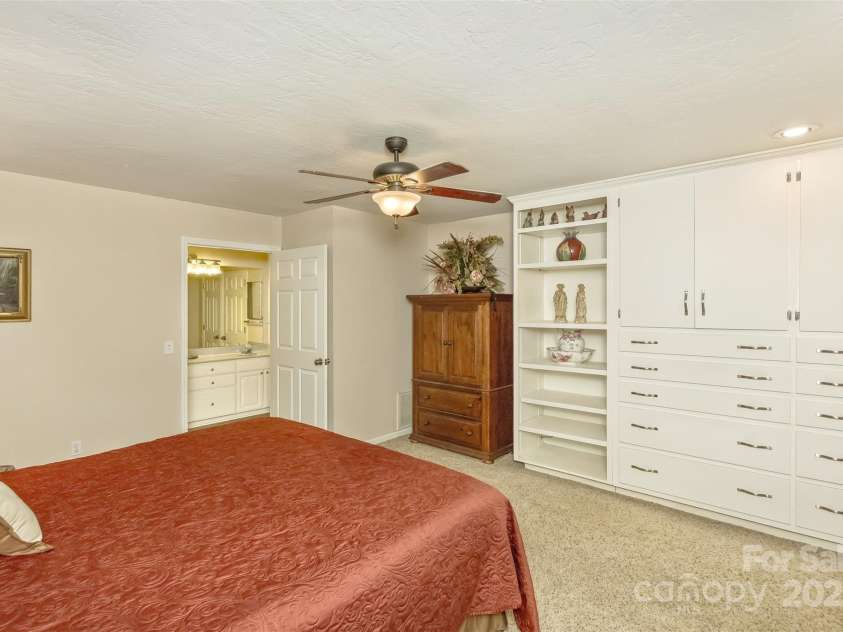 15 Beaverdam Knoll Road, Asheville, NC 28804.  MLS# CAR4283730, YatesRealty ID 1568. In addition to double closets, the bedroom has well-designed built-in storage and shelving.