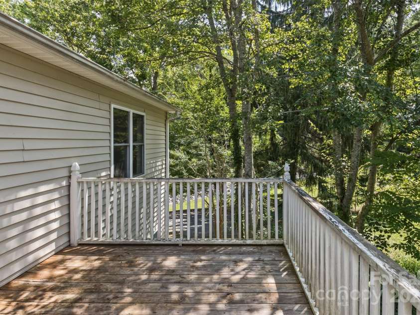 15 Beaverdam Knoll Road, Asheville, NC 28804.  MLS# CAR4283730, YatesRealty ID 1568. Just off the second bedroom, the large side deck is private and great for relaxing.