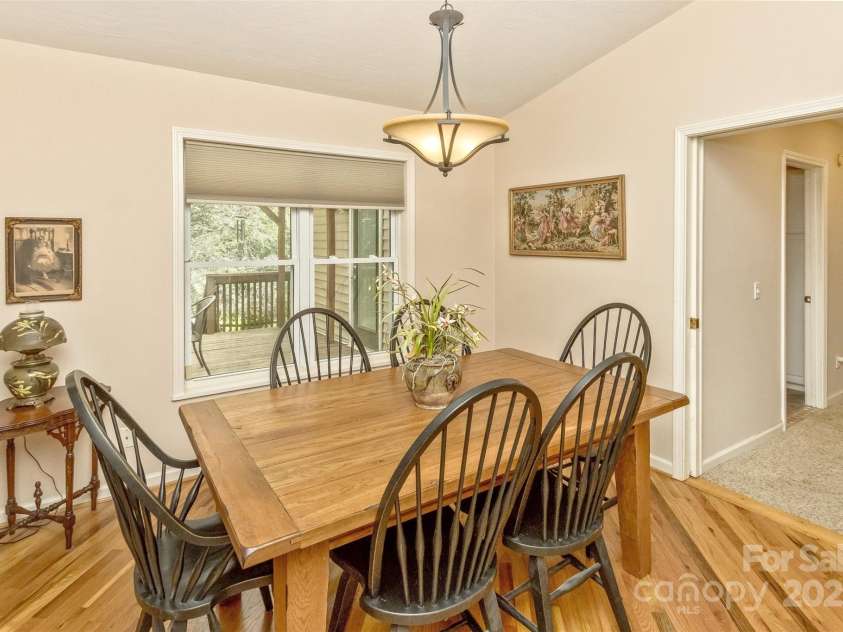 15 Beaverdam Knoll Road, Asheville, NC 28804.  MLS# CAR4283730, YatesRealty ID 1568. Separated from the living room by double pocket doors, the dining room feels open to the living room.
