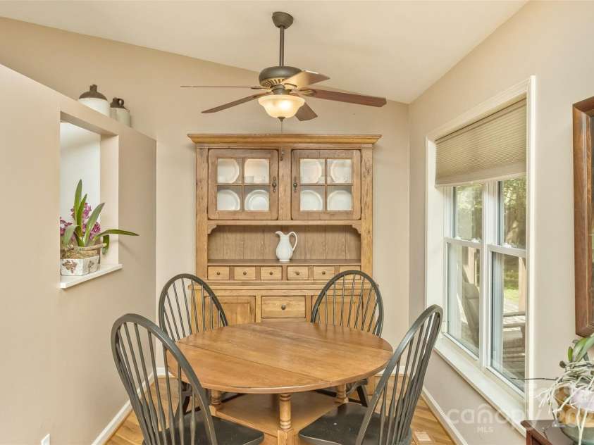 15 Beaverdam Knoll Road, Asheville, NC 28804.  MLS# CAR4283730, YatesRealty ID 1568. The breakfast nook is cozy--and the view to the back yard is sure to provide your day with a bright and cheerful start.