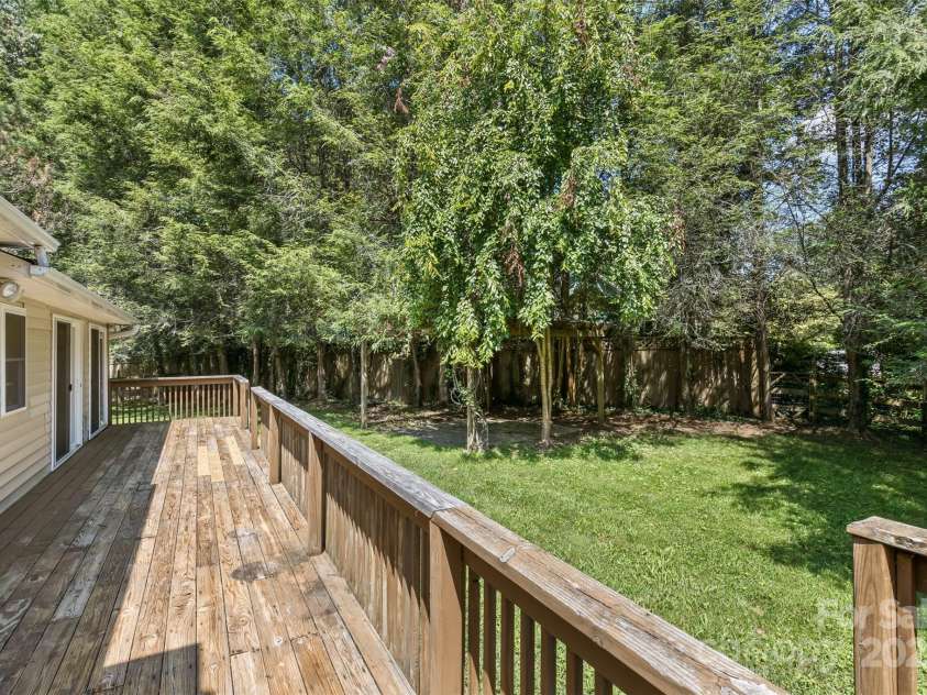 15 Beaverdam Knoll Road, Asheville, NC 28804.  MLS# CAR4283730, YatesRealty ID 1568. The gallery deck is located between the covered deck and the sunroom doors.