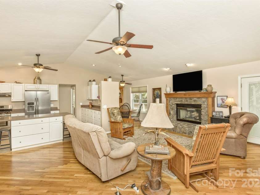 15 Beaverdam Knoll Road, Asheville, NC 28804.  MLS# CAR4283730, YatesRealty ID 1568. The great room truly is the center of the open floor plan--just steps away are the kitchen, dining room, breakfast nook and guest full bathroom.