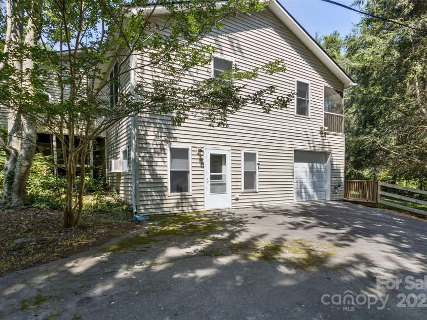 15 Beaverdam Knoll Road, Asheville, NC 28804.  MLS# CAR4283730, YatesRealty ID 1568. The lower driveway is very private and provides convenient access to the apartment and single-car garage.