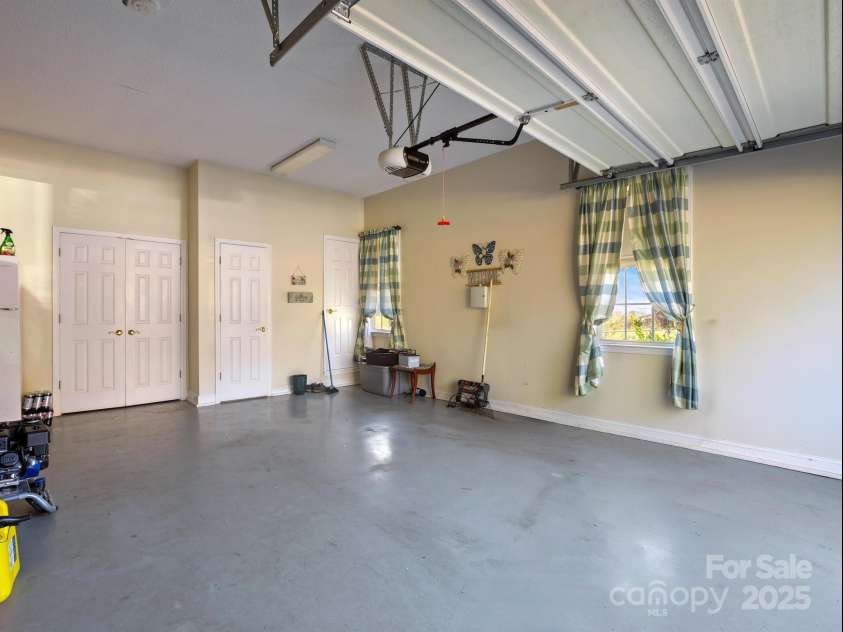 510 Floyd Blackwell Road, Tryon, NC 28782.  MLS# CAR3939567, YatesRealty ID 1568. 2 car Garage with bathroom and storage