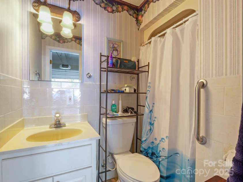 510 Floyd Blackwell Road, Tryon, NC 28782.  MLS# CAR3939567, YatesRealty ID 1568. Garage Bathroom