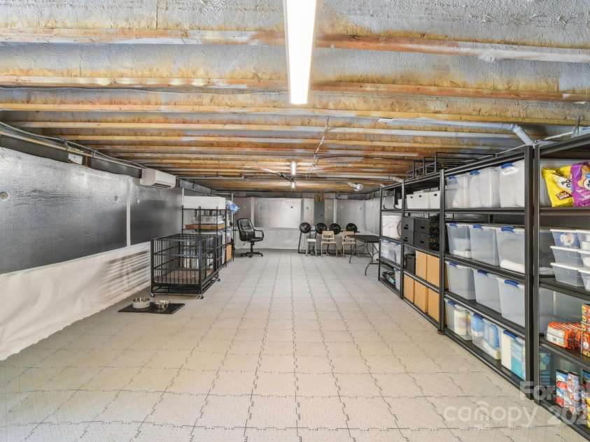 9 Circle Drive, Black Mountain, NC 28711.  MLS# CAR4260626, YatesRealty ID 15687. Check out this totally encapsulated tall crawl space with plenty of room for storage, or a work area.  Even has a mini-split for HVAC