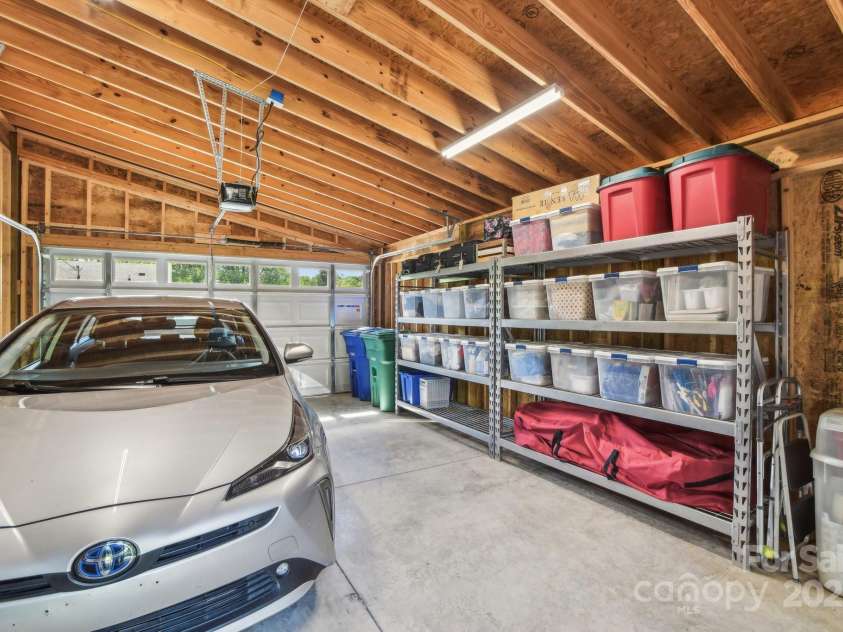 9 Circle Drive, Black Mountain, NC 28711.  MLS# CAR4260626, YatesRealty ID 15687. Interior of the garage, with storage