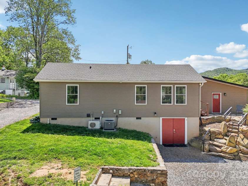 9 Circle Drive, Black Mountain, NC 28711.  MLS# CAR4260626, YatesRealty ID 15687. Rear of #9 with the exterior entry to the tall crawl space.