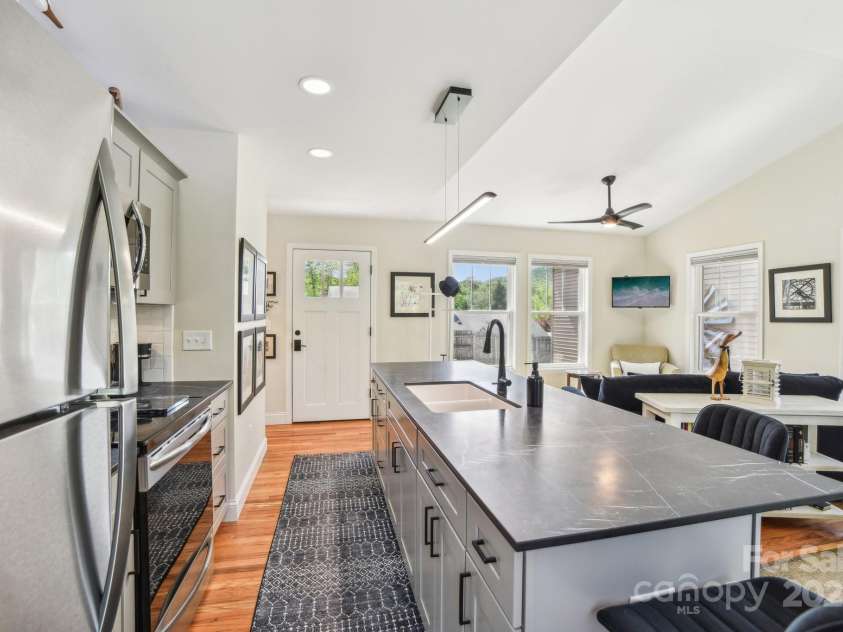 9 Circle Drive, Black Mountain, NC 28711.  MLS# CAR4260626, YatesRealty ID 15687. Stainless appliances and white cabinets