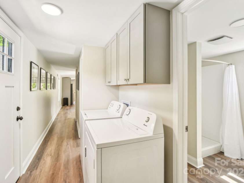 9 Circle Drive, Black Mountain, NC 28711.  MLS# CAR4260626, YatesRealty ID 15687. Washer/dryer in the hallway.