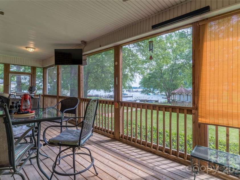 18118 Pompano Place, Cornelius, NC 28031.  MLS# CAR4263080, YatesRealty ID 15689. Dining are on Screened Porch
