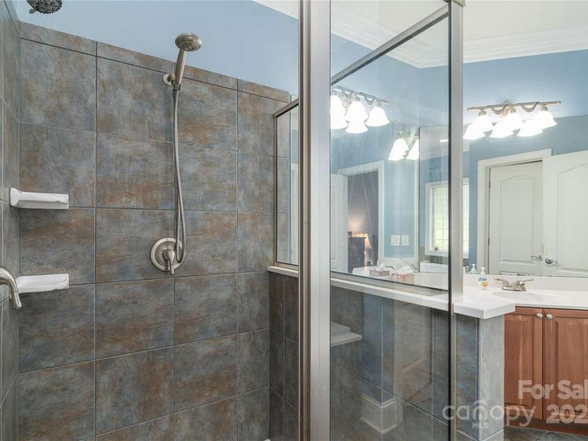 18118 Pompano Place, Cornelius, NC 28031.  MLS# CAR4263080, YatesRealty ID 15689. Large tiled shower with dual shower heads