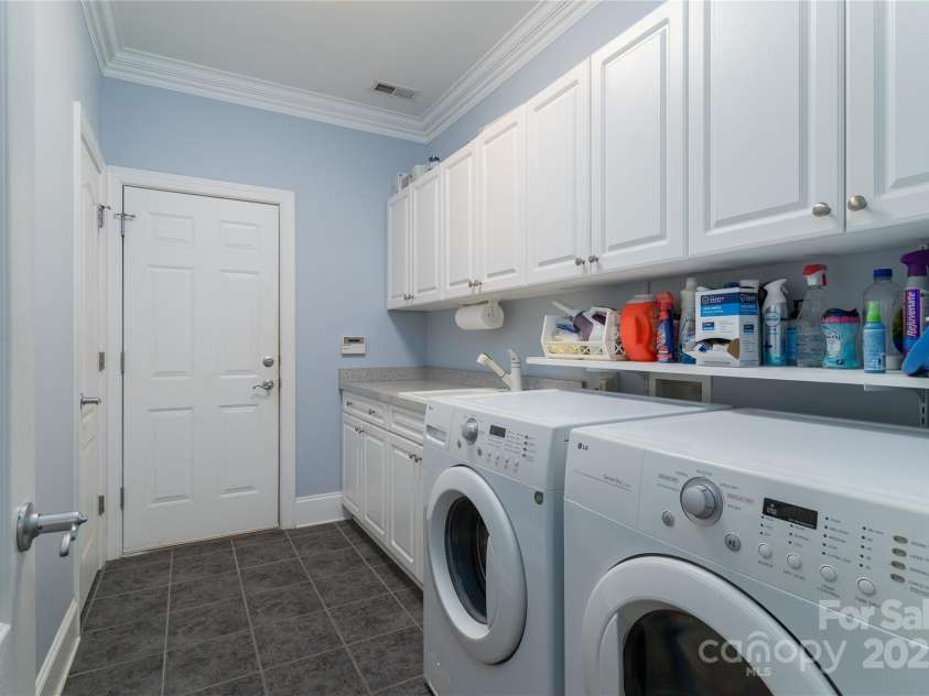 18118 Pompano Place, Cornelius, NC 28031.  MLS# CAR4263080, YatesRealty ID 15689. Laundry Room of the hall goes toward the garage