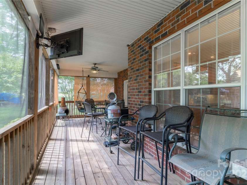 18118 Pompano Place, Cornelius, NC 28031.  MLS# CAR4263080, YatesRealty ID 15689. Screened Porch off Primary Bedroom