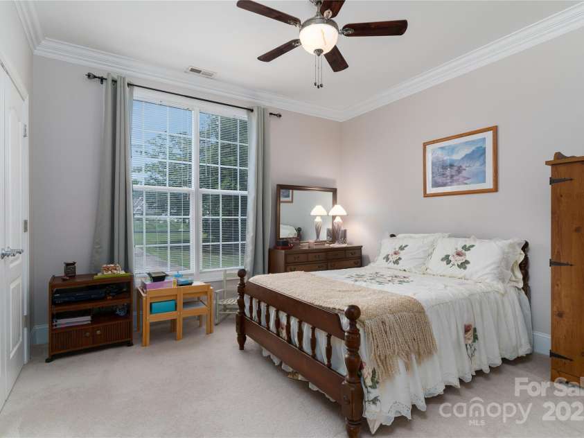 18118 Pompano Place, Cornelius, NC 28031.  MLS# CAR4263080, YatesRealty ID 15689. Second bedroom is spacious with ceiling fan