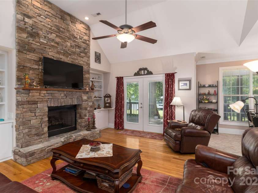 18118 Pompano Place, Cornelius, NC 28031.  MLS# CAR4263080, YatesRealty ID 15689. Stacked stone fireplace in Great Room