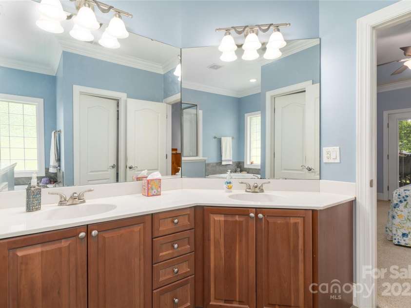 18118 Pompano Place, Cornelius, NC 28031.  MLS# CAR4263080, YatesRealty ID 15689. Walk through primary bath to huge walk-in closet