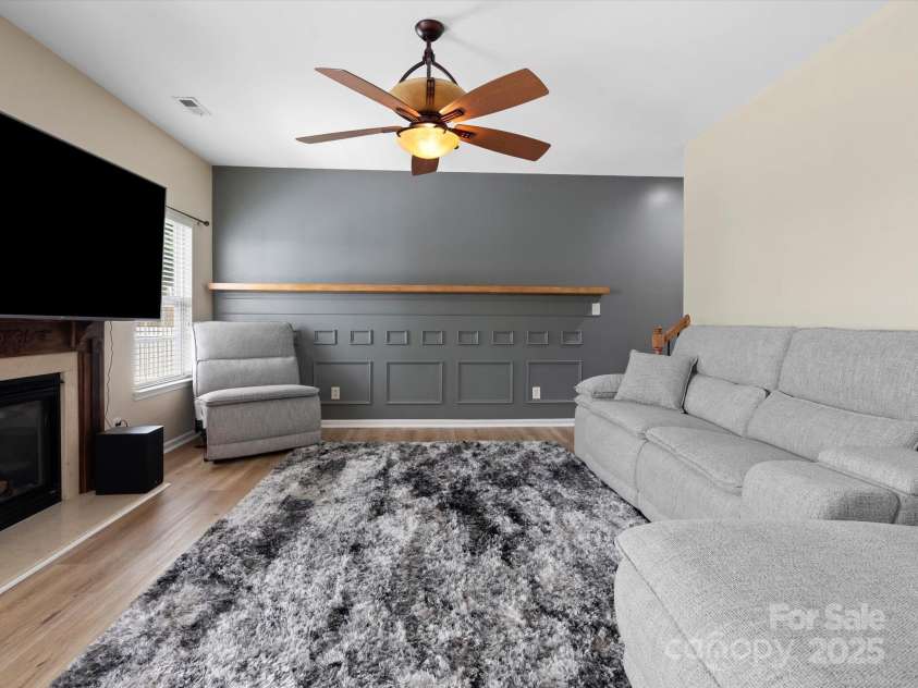 1051 Streamlet Way, Monroe, NC 28110.  MLS# CAR4259540, YatesRealty ID 15694. Great room with fireplace.