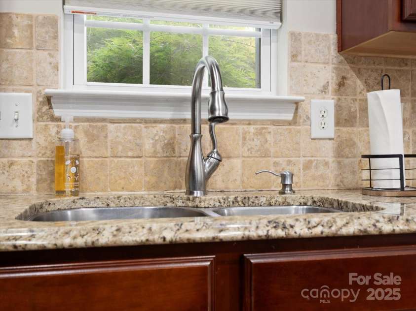 1051 Streamlet Way, Monroe, NC 28110.  MLS# CAR4259540, YatesRealty ID 15694. Sink and window overlooking back yard.