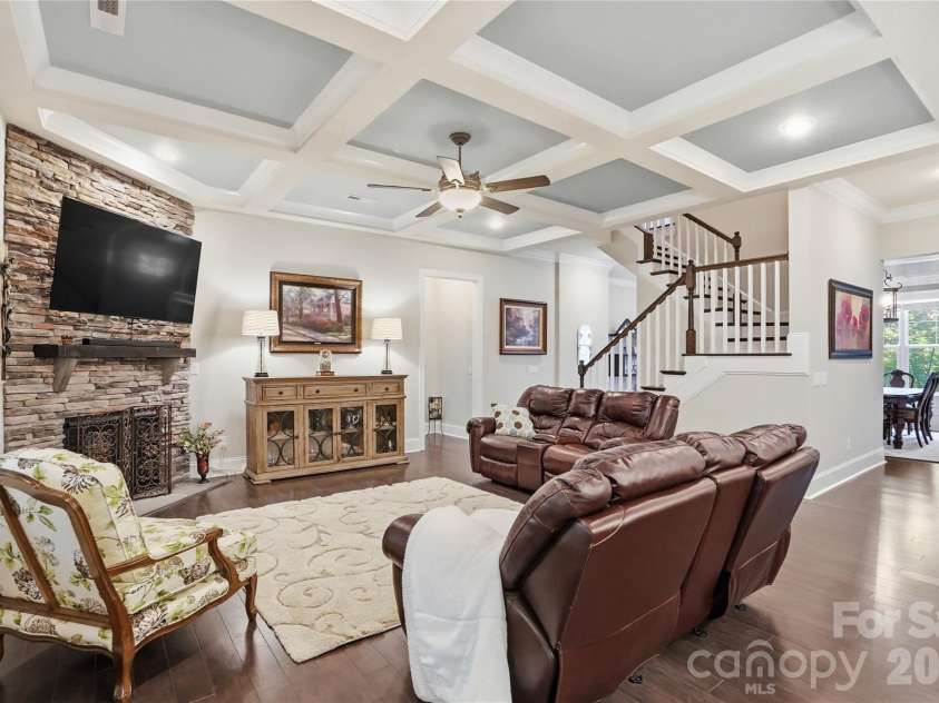 124 Shimmerlake Lane, Belmont, NC 28012.  MLS# CAR4372639, YatesRealty ID 15698. Gathering Room with Coffered Ceiling and inviting stone fireplace