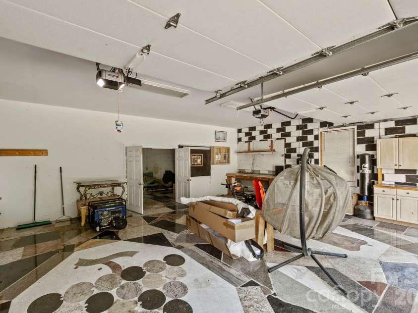 652 Avery Creek Road, Arden, NC 28704.  MLS# CAR4282113, YatesRealty ID 15716. Detached garage with workshop room in back